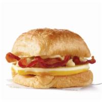 Bacon, Egg & Swiss Croissant  · A fresh-cracked grade A egg and Applewood smoked bacon covered in creamy swiss cheese sauce ...