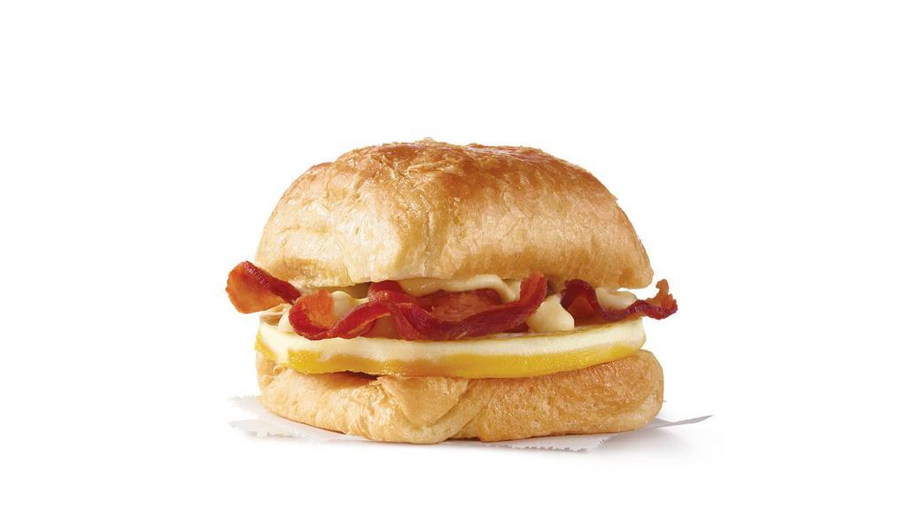 Bacon, Egg & Swiss Croissant  · A fresh-cracked grade A egg and Applewood smoked bacon covered in creamy swiss cheese sauce on a flaky croissant bun. Breakfast basics worth waking up early for.