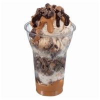 Reese'S® Peanut Butter Cup Layered Sundae · Three scoops of REESE'S® Peanut Butter Cup Ice Cream topped with layers of REESE'S® peanut b...