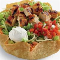 Classic Chicken Tostada Salad · A delicious combination of citrus-marinated chopped chicken, chopped romaine lettuce blend, ...