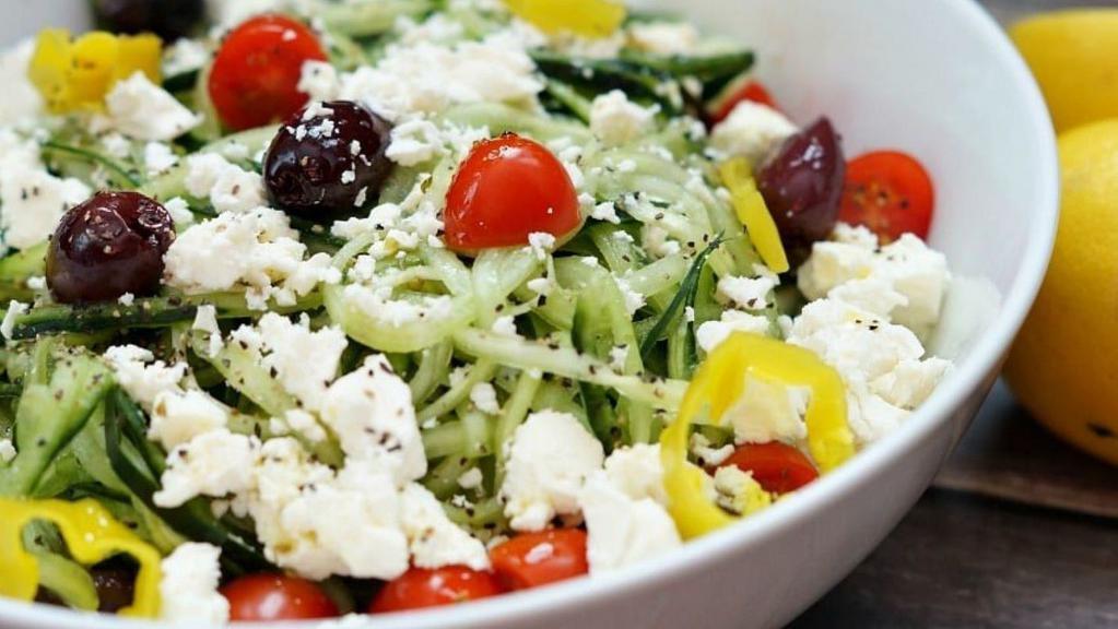 Greek Salad (Party) Serves 10-12 · Romaine Lettuce, Red Onions, Kalamata Olives, Roma Tomatoes, Feta Cheese, Oregano, Imported Sliced Yellow Pepperoncini.