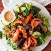 Jerk Chicken Salad · Marinated and grilled chicken, served in house made jerk sauce. With a large bed of mixed gr...