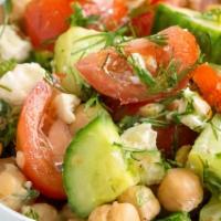 Chickpea Salad · Vegan. Spicy chickpeas on a bed of mixed greens. Topped with cucumbers, tomatoes, black oliv...