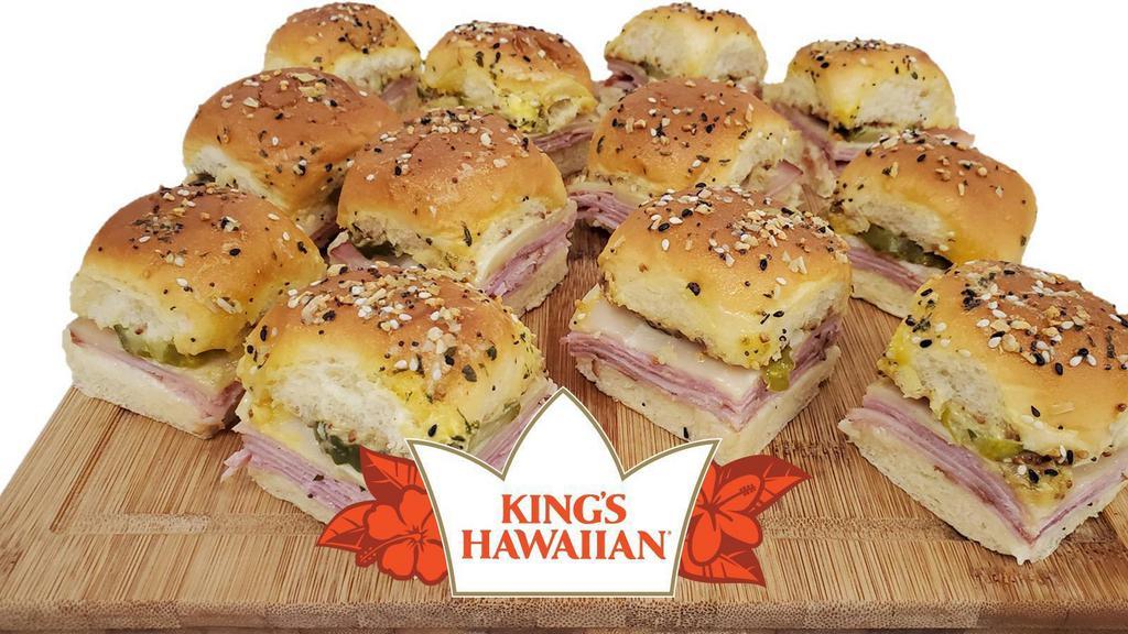 Deli Hawaiian Ham Sliders, 12 Ct. · King's Hawaiian rolls, ham off the bone, mayo, deli style mustard, Swiss cheese, dill pickles, garlic butter spread, everything bagel seasoning. Note: this item requires 12 min in oven. Full instructions will be included.