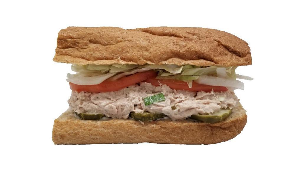 Tuna Salad Sandwich · Tuna salad sandwich: whole wheat roll, tuna salad, mayonnaise, pickles, shredded iceberg lettuce, sliced tomato.