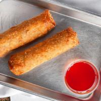 Chicken Egg Rolls (1) · A large egg roll with chicken and vegetables inside.