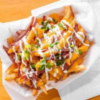 Loaded Fries · Crispy french fries with cheese whiz, bacon, and mozzarella cheese served with ranch.