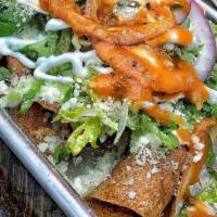 Potato Taquitos (3) · 3 Taquitos Topped with romaine lettuce, onions, cotija cheese, sour cream and  Habanero and ...