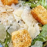 Classic Caesar Salad · Romaine lettuce, shaved parmesan, croutons, Caesar dressing, and shredded chicken.