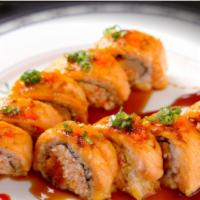Spicy Baked Salmon Roll · Baked spicy crab avocado inside with salmon topped with masago, green onion and eel sauce.