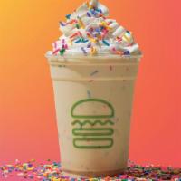 Sprinkle Cookie Shake · Cookie butter frozen custard hand spun with rainbow crispies and topped with whipped cream a...