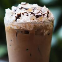 Mexican Mocha · Shown iced with a touch of whip and chocolate drizzle.

* contains products made with peanut...