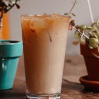 Thai Coffee · House coffee mixed with sweetened condensed milk.

Shown iced but also available as a hot dr...
