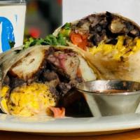 Breakfast Burrito · From Orphan Breakfast House! Scrambled eggs, beans, potatoes, and bacon wrapped in a flour t...