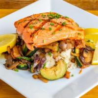 Wild Alaskan Salmon · Served grilled over a bed of spinach and ratatouille, with a side of roasted wedgies, garlic...