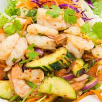 Grilled Shrimp Salad · Red onions, cilantro, tomatoes, cucumbers, carrots, lettuce, red cabbage, and spicy lime dre...