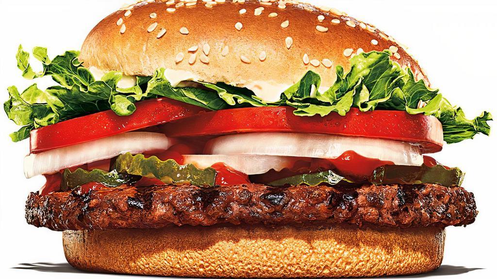 Impossible™ Whopper · A flame-grilled, plant-based patty with juicy tomatoes, crisp lettuce, creamy mayonnaise, ketchup, crunchy pickles, and sliced white onions on a toasted sesame seed bun. *Patty cooked on the same broiler as beef patties.