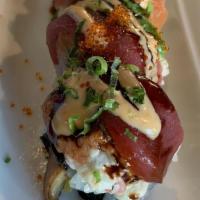 Albacore Delight Roll (New And Hot) · fresh spicy albacore with fresh english cucumber top with seared fresh albacore. (ponzu sauc...