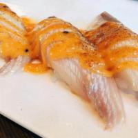 Flame Grilled Yellow Tail Belly Large Sushi · 2pcs Flame Grilled Yellowtail Belly Large Sushi topped with spicy mayo sauce