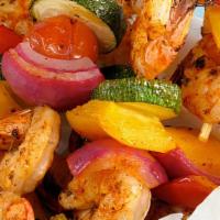 Shrimp Kabob · Marinated tiger shrimp, charbroiled and served with garden salad and white basmati rice.