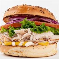 Deli Turkey Bagel Sandwich · Fresh, thinly sliced deli turkey. Comes with lettuce, tomato, onion, cheese, mayo and mustard.