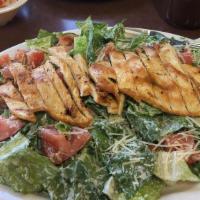 Chicken Caesar Salad · Romaine lettuce and homemade croutons dressed with parmesan cheese, Caesar dressing and gril...