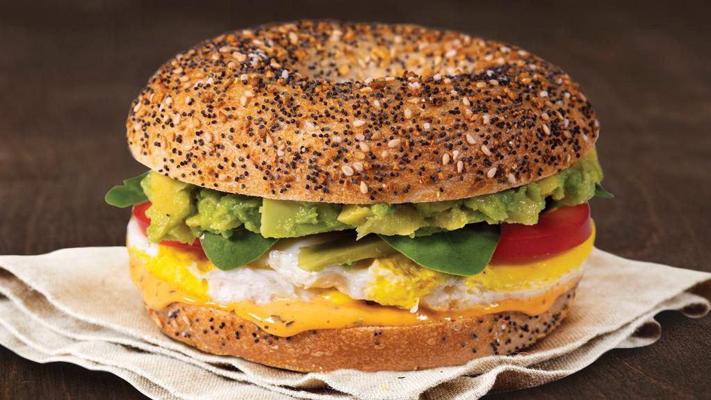 Garden Avocado Egg Sandwich · Cage-free egg, avocado, tomato, spinach and roasted tomato spread on an Everything Bagel.