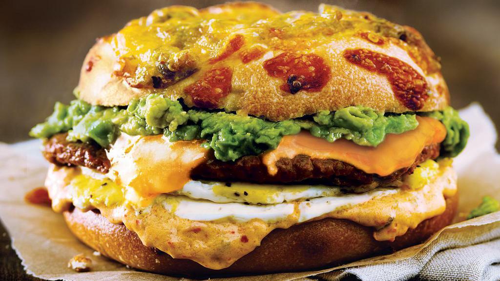 Chorizo Sunrise Egg Sandwich · Green Chile Gourmet Bagel with chorizo sausage, avocado, cheddar cheese, cage-free eggs and Jalapeño Salsa Shmear