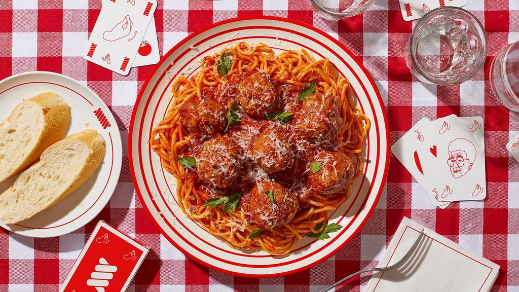 Spaghetti & Meatballs · Spaghetti tossed in a tomato sauce with beef meatballs.