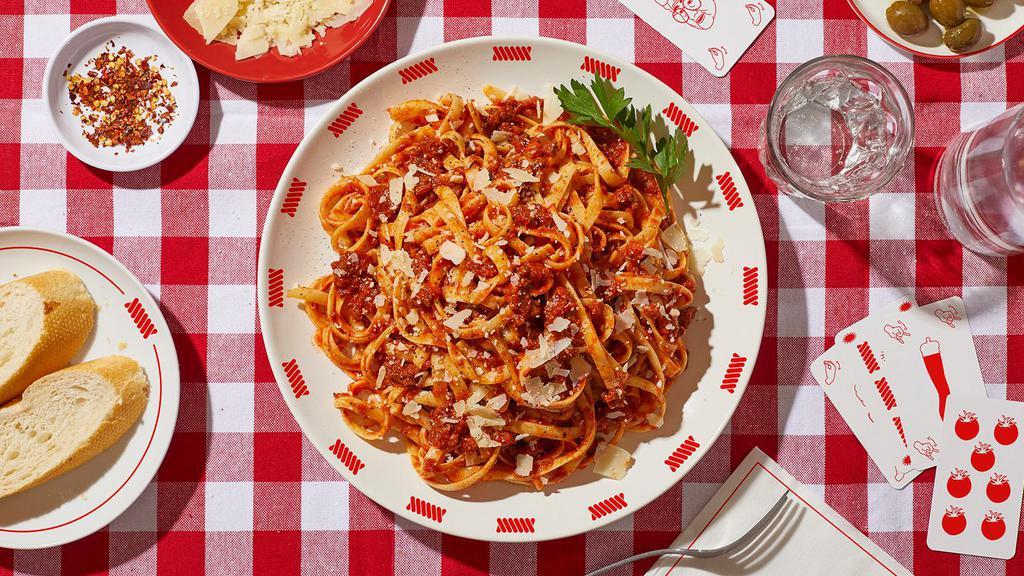 Fettuccine Bolognese · Fettuccine pasta tossed in a rich bolognese meat sauce.