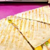 Sincronizada · Quesadilla with Jack & yellow cheese onion, tomato, lettuce, pickled jalapeños & meat.