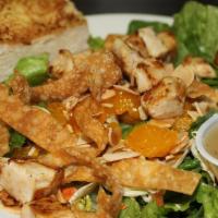 Chinese Chicken Salad · Tender grilled chicken breast, fresh greens, red cabbage, carrots, toasted almonds, mandarin...