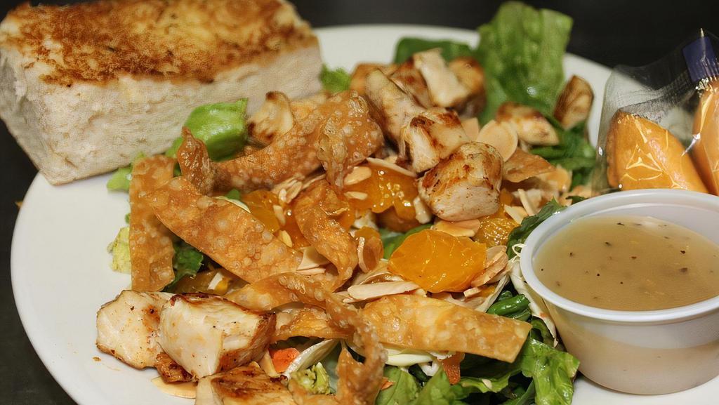 Chinese Chicken Salad · Tender grilled chicken breast, fresh greens, red cabbage, carrots, toasted almonds, mandarin oranges and crispy wontons, tossed with sesame seed dressing.