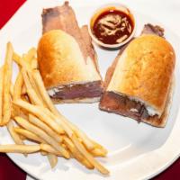 Wood Smoked Bbq Tri - Tip Sandwich · Sliced tri-tip with Bbq sauce and au jus a French roll.