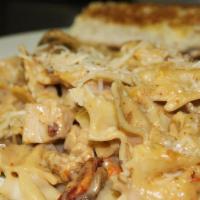 Blacken Chicken Pasta · Tender chicken breast, bow tie pasta with alfredo sauce, smoked bacon, sun dried tomatoes, m...