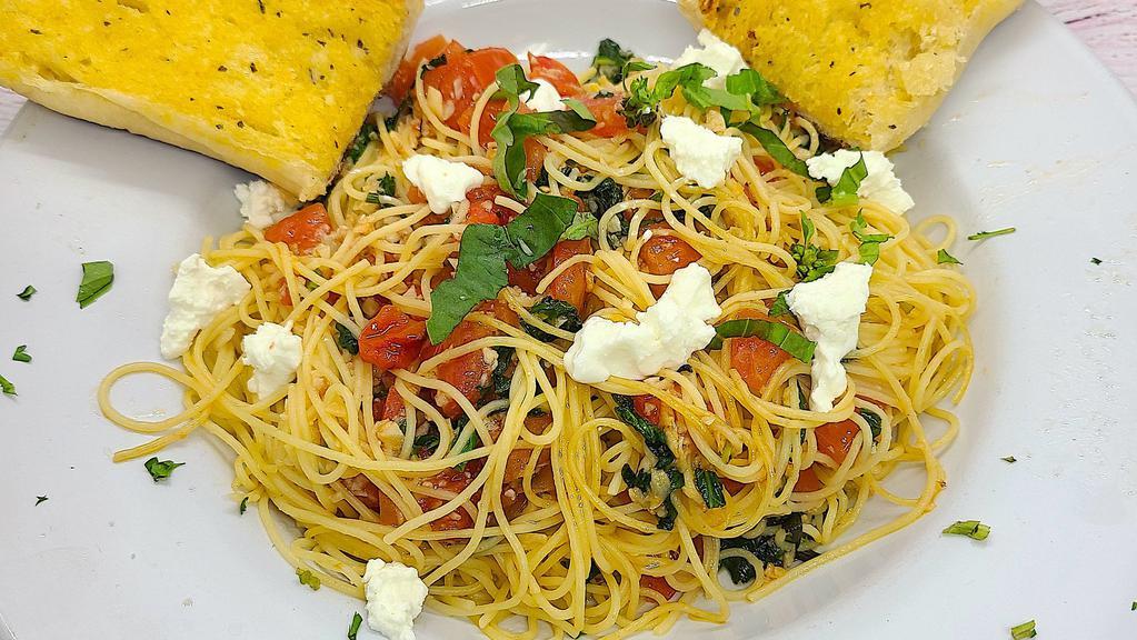 Angel Hair Pomodoro · Angel Hair Pasta, and Fresh Roma Tomatoes sauteed in Olive Oil, with fresh pressed garlic, and fresh basil, topped with Parmesan Romano cheese.