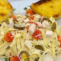 Kickin’ Chicken Pasta · Chicken, tomatoes, and jalapeños lightly sauteed in our Alfredo sauce tossed with fettuccine...