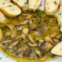 Sautéed Chicagaoua Shrooms · This wonderful appetizer has bunches of sautéed mushrooms tossed in a garlic wine butter sau...