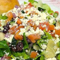 Greek Chopped Salad (Regular) · Romaine, kalamata olives, feta cheese, artichoke hearts, red onions, tomatoes and cucumbers ...