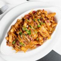 Cajun Taters · Bacon, green onion, Cajun spice & sauce. Choice of beer cheese sauce or melted shredded ched...