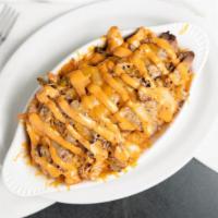 Philly Taters · Tri tip, bell pepper, onion, chipotle sauce. Choice of beer cheese sauce or melted shredded ...