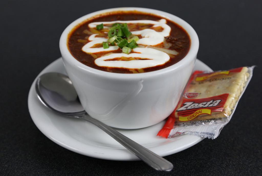 Chili · Topped with cheese, sour cream, green onion.