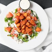 Buffalo Chicken Salad · Grilled or crispy chicken, blue cheese crumbles, frank's red hot sauce, tomato, onion, blue ...