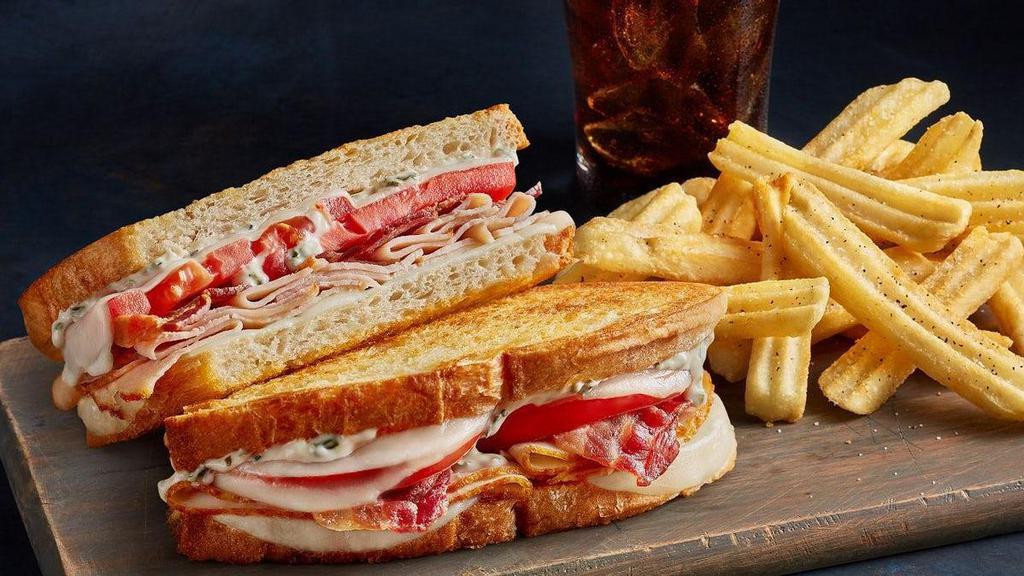 Talkin' Turkey Melt - Combo · We're talkin' turkey, bacon, tomatoes, Provolone cheese and sun-dried tomato mayo on grilled artisan bread. Includes your choice of a drink and a side to round out the meal.