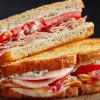 Talkin' Turkey Melt · We're talkin' turkey, bacon, tomatoes, Provolone cheese and creamy herb spread on grilled ar...