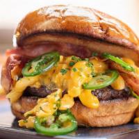 Dirty Mac Burger · 6oz signature burger patty, cheddar mac n cheese, jalapeno, bacon, brioche bun. Served medium.