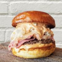 The Blackstone Burger · 6oz signature burger patty, corned beef, smoked swiss, caramelized onions, sauerkraut, thous...