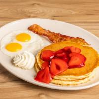 Fresh Strawberry Pancakes Combo · Our delicious buttermilk pancakes ladled with a fresh strawberry topping and fresh whipped c...