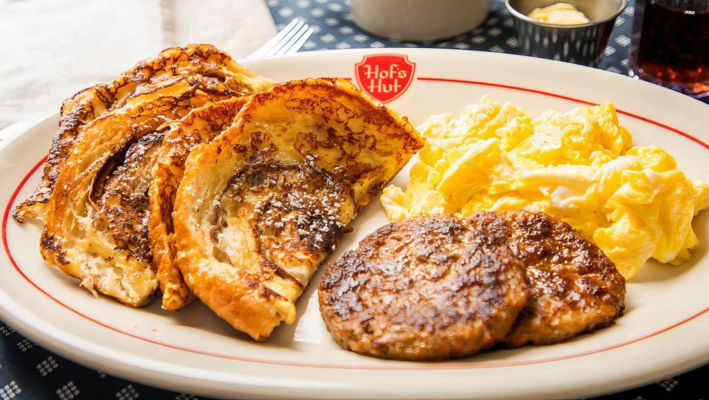 Cinnamon Roll French Toast Combo · Cinnamon roll French toast with two eggs and your choice of bacon or sausage patties or links.