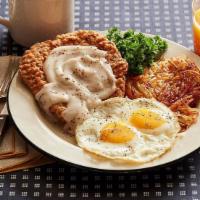 Chicken Fried Steak With 2 Ranch Eggs · Two eggs with a tender cut of beef steak, breaded and golden fried and smothered with countr...